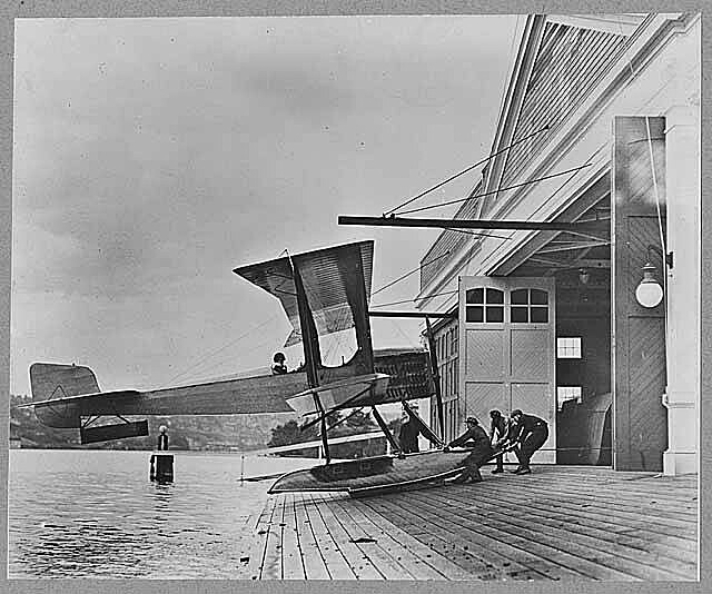 Men_pulling_B_&_W_into_Boeing_Seaplane_Hangar_on_Lake_Union,_Seattle,_1916_(MOHAI_1818).jpg